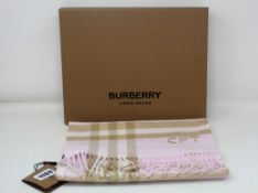 An as new Burberry giant check cashmere scarf (Initialled CFT).