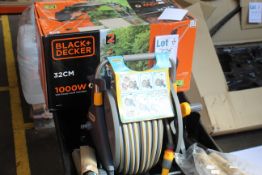 A Defiance Wheelbarrow, a Hozelock Plus 2435, a boxed Black + Decker BEMW351 32cm Rotary Lawn Mower,