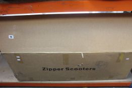 A boxed Zipper Scooter (Model: GS4905).