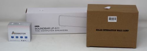 One box containing Solar Interaction Wall Lamps, Soundbar LP-S11 Computer Speakers, SAD Lights and