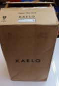 A boxed Kaelo integrated wine cooler in brushed black.