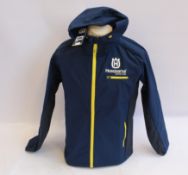 An as new 2020 Husqvarna replica team hardshell jacket (M - RRP £170).