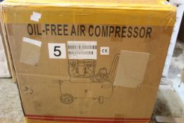 A boxed sealed Oil-Free Air Compressor 750-30L in white.