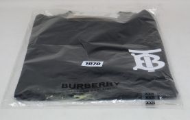 An as new Burberry Atherton long sleeved monogramed top in black (XXS - RRP £370).