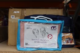 A quantity of as new Kozee Komforts items to include two Universal Skoota bags in maroon, economy