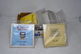 A box of coin collections and year sets, seventeen Royal Mint special pack for Guernsey, Jersey