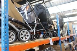 Five pushchairs/buggies and a wheelchair.
