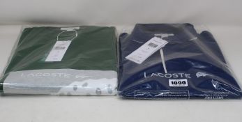 An as new Lacoste blue polo shirt (Size FR 4 - RRP £110) and Lacoste sweatshirt in green (FR 4 - RRP