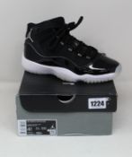 A pair of youths as new Nike Air Jordan 11 Retro sneakers (UK 4).