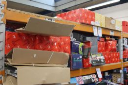 A shelf of assorted car parts to include coil springs, alternators, water pumps, brake discs, timing
