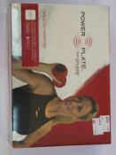 A boxed as new Power Plate dual sphere vibration roller in Red.