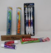 A large quantity of kids Colgate toothbrushes and toothpaste (20ml), approximately 100 kids