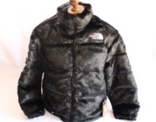 An as new Supreme X The North Face Faux Fur Nuptse jacket in black (XL).