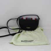 An as new Burberry tartan Olympia mini bag (RRP £390).