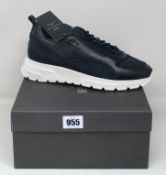 A pair of as new Mario Falcone Belvotti Milano trainers (UK 8).