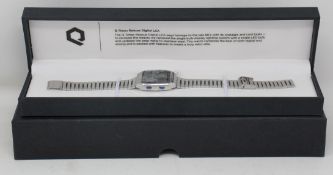 An as new Q Timex Reissue Digital LCA 32.5mm stainless steel bracelet watch in case.