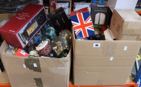 Two boxes of assorted snow globes.