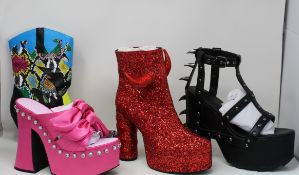 A pair of Sugar Thrillz Strike a Pose Bow mule heel shoes in pink (US 11M), Dolls Kill date The