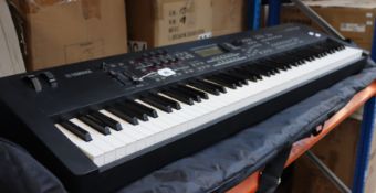 A pre-owned Yamaha MOX8 Music Production Synthesizer with stand (Damaged, no power cables, sold as
