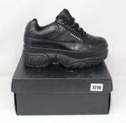 A pair of as new Naked Wolfe Stomper trainers (UK 9).