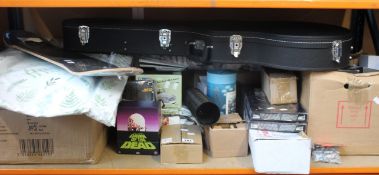 One shelf of miscellaneous items to include a Thoman guitar case, as new Magical Bath Surprise