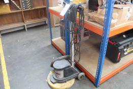 A pre-owned floor polisher.