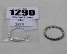 An as new Pandora string of beads ring (197536-54), an as new bands of hearts ring (190980-60) and