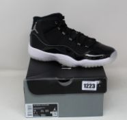 A pair of youths as new Nike Air Jordan 11 Retro sneakers (UK 6).