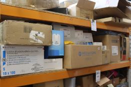 A quantity of assorted medical items to include blood glucose test strips, face masks and latex