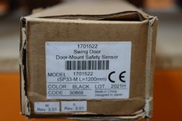 A boxed as new swing door mount safety sensor.