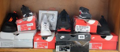 Seven pairs of infants/children's as new Nike trainers.