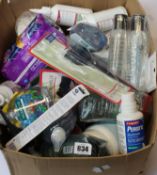 Two boxes of assorted as new toiletries/beauty products and related items.