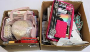 Two boxes of assorted as new luxury beauty products.