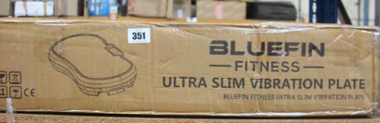 A boxed Bluefin Fitness Ultra Slim Vibration Plate.