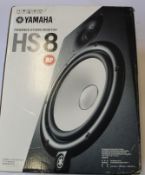 A boxed Yamaha HS8 Powered Studio Monitor.