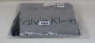 A pair of Calvin Klein long sleeve knit pyjama set (14-16), two pairs of sleep pants (M, XL) and