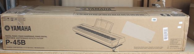 A boxed Yamaha P-45B Digital Piano in black.
