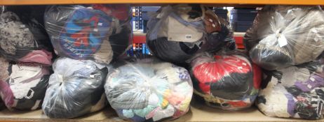 Nine bags of assorted clothing and related items.