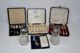 A box of silver to include mixed lot of cased spoon sets, masonic items, silver backed mirror,