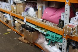 Two shelves containing homeware and related items to include wallpaper, beanbags and curtains.