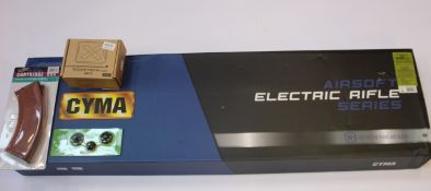 A CYMA AK-47 CM.048M Airsoft Electric Rifle with accessories including a Airsoft Chronograph