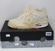 A pair of women's as new Nike X Off-White Air Jordan 4 Retro SP (UK 9.5).
