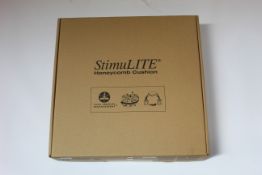 A boxed as new Stimulite Slimline XS Wheelchair Cushion (13 x 16).