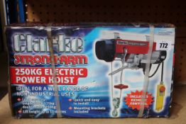 A boxed as new Clarke Strong-Arm CH2500B 250 Electric Power Hoist.