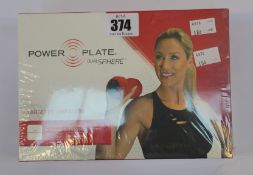 A boxed as new Power Plate dual sphere vibration roller in Red.
