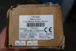 A boxed as new swing door mount safety sensor.