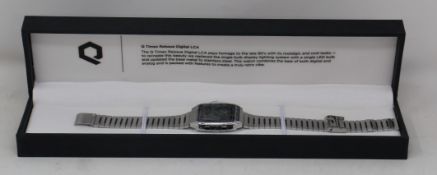An as new Q Timex Reissue Digital LCA 32.5mm stainless steel bracelet watch in case.