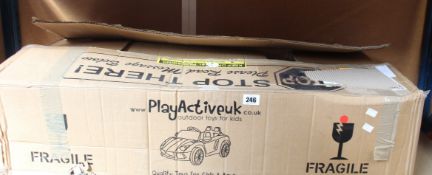 A child's boxed ride-on 12V battery operated car in red (PA-1188-12V).