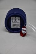 Three boxed as new Swarovski rocking Santa ornaments.