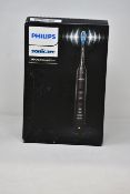 A boxed as new Philips Sonicare 9000 DiamondClean Electric Toothbrush in black.
